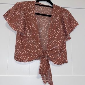 Pink shirt with white polkadots